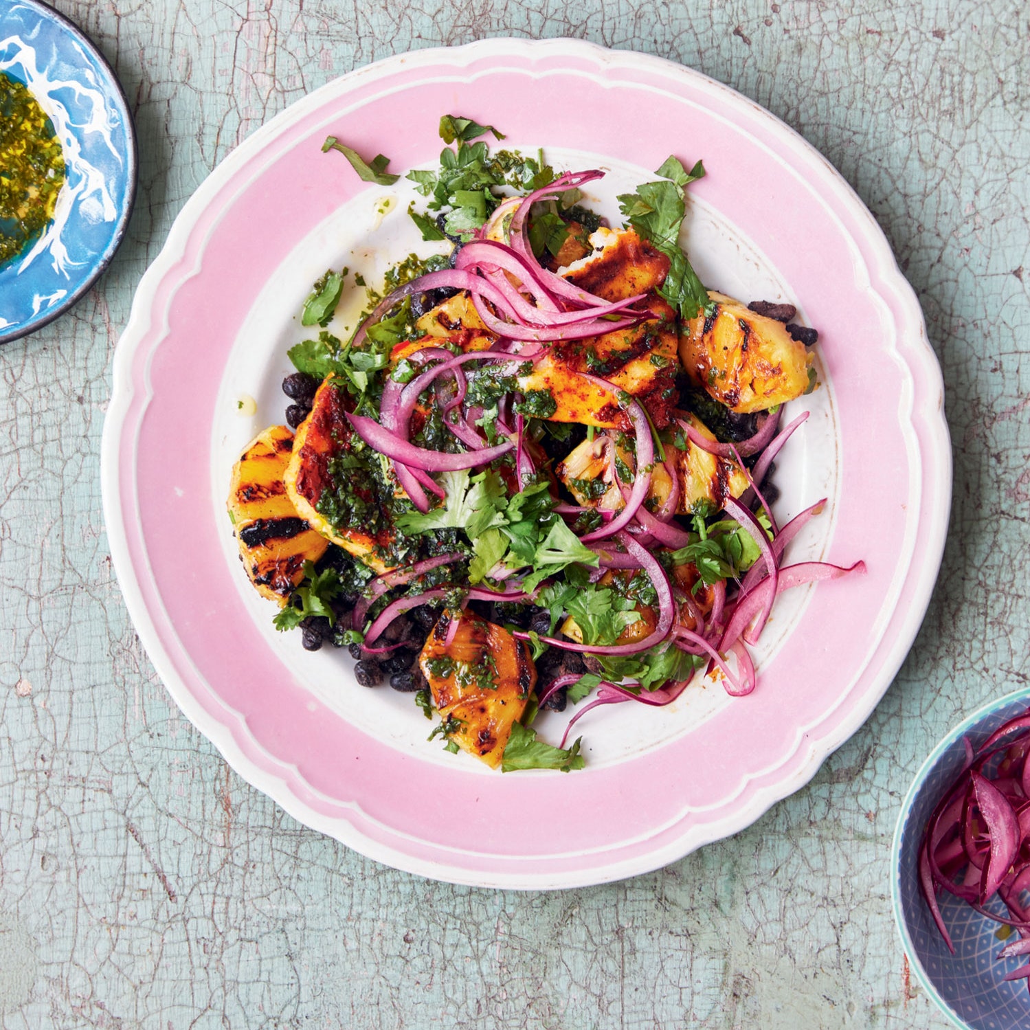 Grilled pineapple and halloumi salad with pink pickled onions