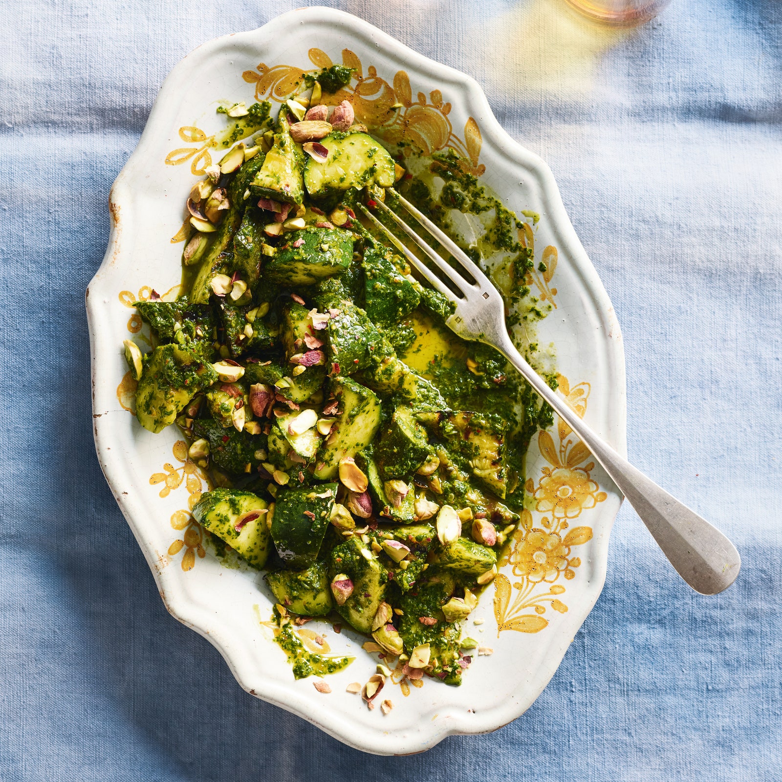 Grilled courgettes with zhoug and pistachios